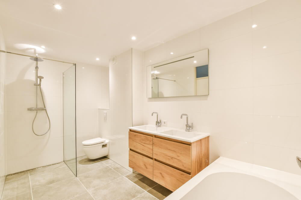 clean, newly-built bathroom, mirror above two sinks - SMI Handyman Leeds, Horsforth